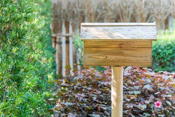 wooden sign is blank for the fill it in the garden.