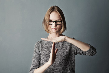 Closeup portrait woman showing time out gesture with hands