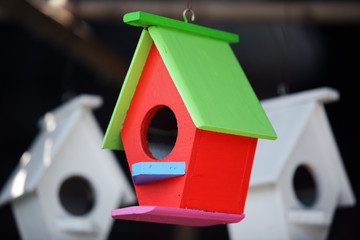 Obraz na płótnie Canvas creative colorful wooden bird house as background.