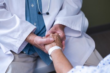 Doctor examining senior patient