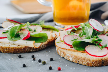 Spring sandwiches with ham, lettuce and radish
