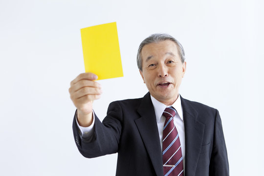 Businessman Showing Yellow