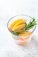 Fototapeta na wymiar Grapefruit rosemary fresh infused water detox drink cocktail lemonade
