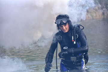 beautiful caucasian diver woman in the water