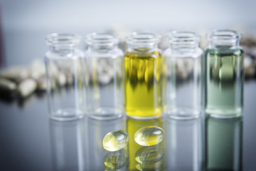capsules of oil, instruments in laboratory
