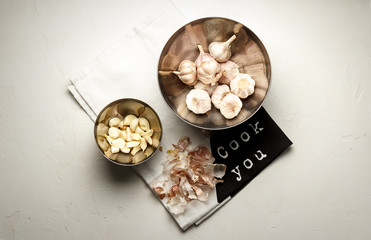 Fototapeta na wymiar Garlic. Garlic Cloves and Garlic Bulb over white stone background