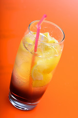 Studio shot of drink on orange background