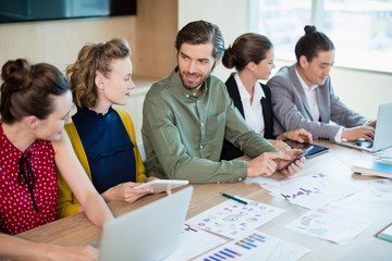 Fototapeta premium Smiling business team interacting with each other