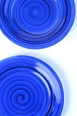 Blue plates on white background