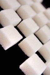 Lump sugar on black background