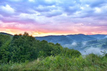 Majestic sunset in the mountains landscape. Overcast sky before storm. Carpathian, Romania, Europe. Beauty world.