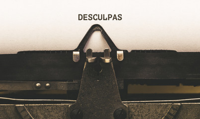 Desculpas, Portuguese text for Excuses on vintage type writer from 1920s