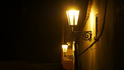 Vintage lantern at the night street. Hystoric building