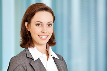 Portrait of young caucasian businesswoman in office