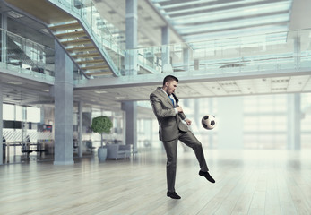 Playing football in office . Mixed media