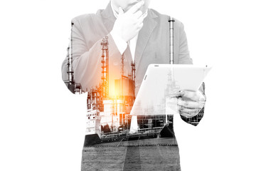 Double exposure of success businessman using digital tablet or smartphont with city landscape background
