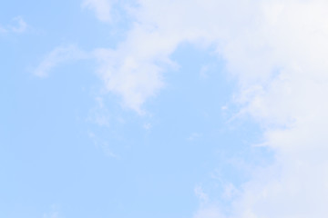 White fluffy clouds in  blue sky and space
