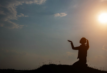 silhouette woman pray to god