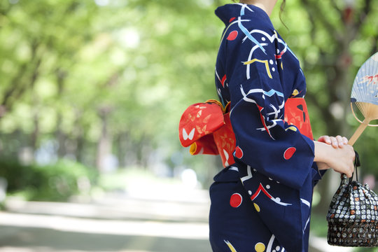 Midsection of young woman wearing Yukata
