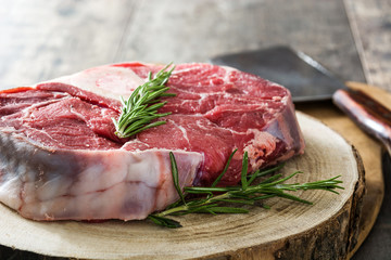 Raw meat on wooden background
