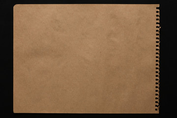 Brown paper sheet isolated on black background