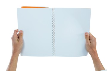 Hands holding a blank book