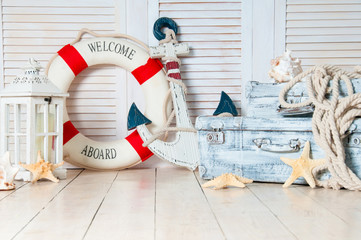 Decor in the style of sea travel, Suitcases and anchor, lifebuoy, lantern