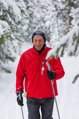 seniors in winter on snow with skis cross-country skiing