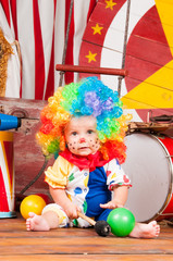 Little baby clown with red nose multi-colored wig in with balls