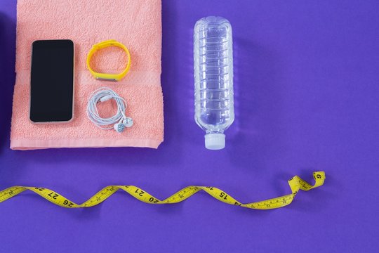 Water bottle, towel, measuring tape, mobile phone 