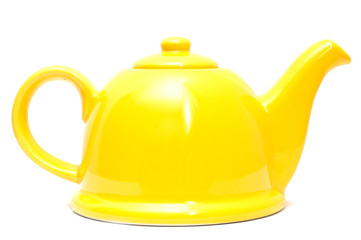 Yellow teapot isolated white background