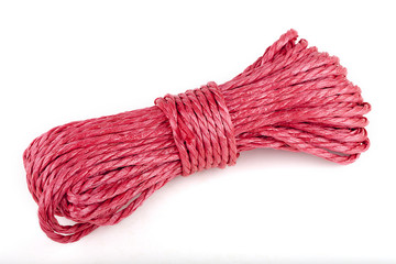 Roll of red rope isolated on white