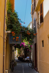 Rethymno, Greece - August  3, 2016: Narrow venetian street in old town.