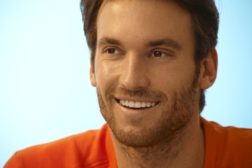 Obraz premium Portrait of happy handsome casual man with stubble