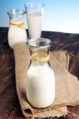milk products - tasty healthy dairy products on a table on: and milk jar, glass bottle and in a glass
