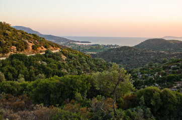 Fototapeta na wymiar Panorama of a small greek village by the sea at sunset, Sithonia, Greece