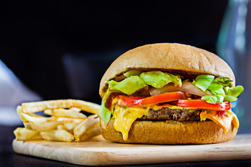 Close up cheese burger on wooden board