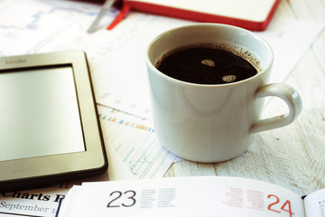 Workplace in office, coffee and ebook