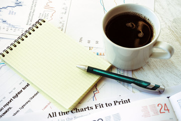 Workplace in office, coffee and notebook