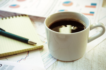 Workplace in office, coffee and notebook