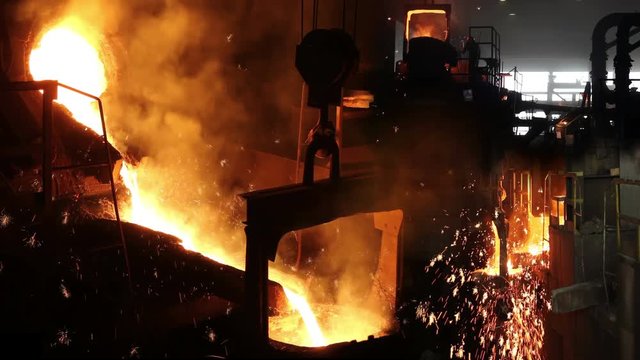 Liquid metal in the foundry, melting iron in furnace, steel mill