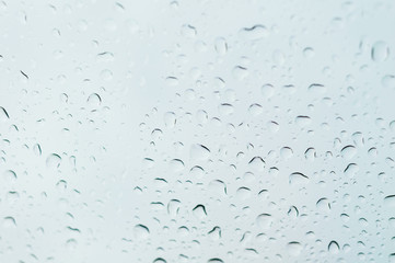 Close up to water drops on glass with selective focus
