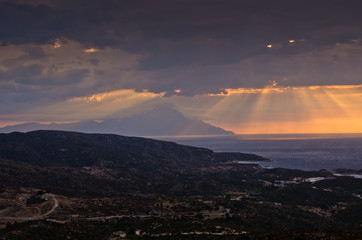 Stormy sky and sunrise at holy mountain Athos in Greece