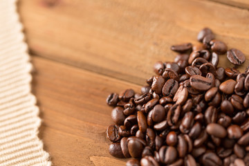 Coffee Beans and Cloth on Wood. coffee beans and cloth on wood close up from above