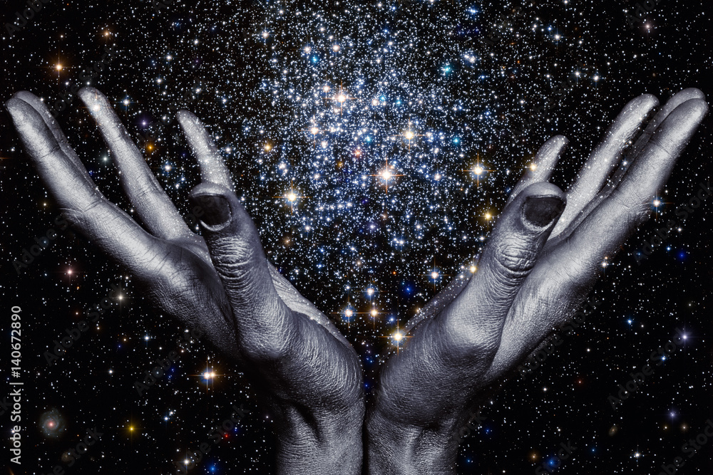 Wall mural god's hands holding a star galaxy