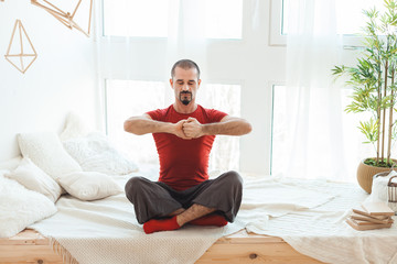 Guy clasped his hands for meditation, he does yoga.