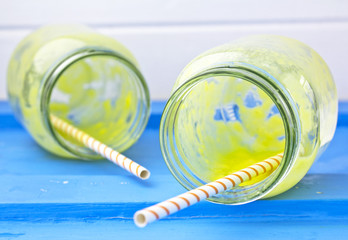 Mango and lime smoothie in jars 
