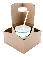 Drink cup with straw in cardboard take out carton. Isolated.