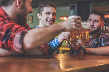 Group Of Hipster Friends Drinking Craft Beer focus on Hipster