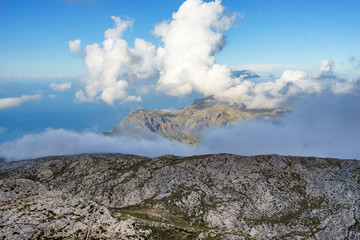 Fototapeta na wymiar Rocky mountains and a clouded sky